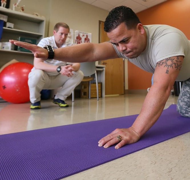 man having a workout session with his trainer